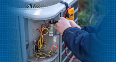 Repair technician working on an air conditioning unit