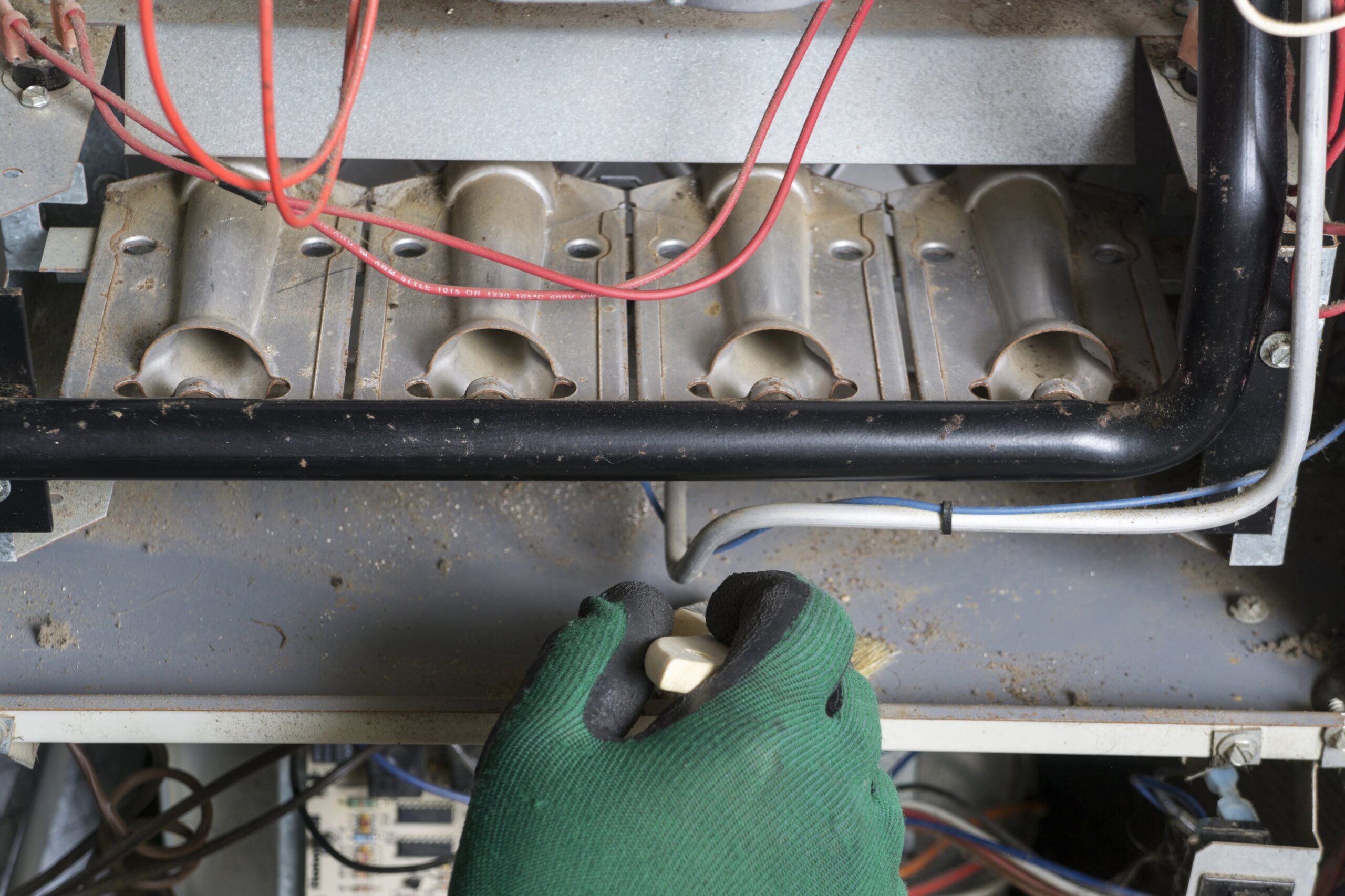 man working on furnace