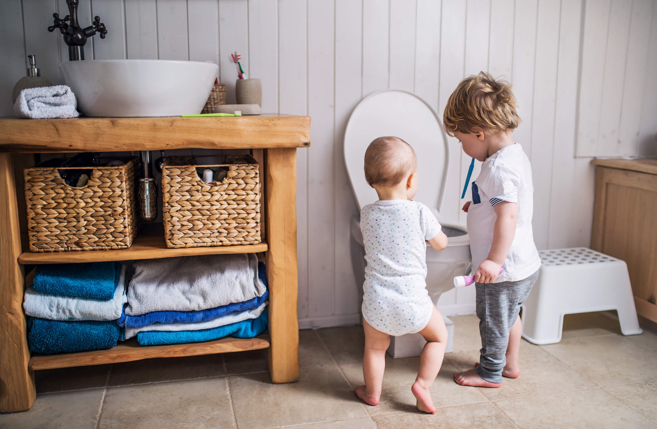 children next to toilet