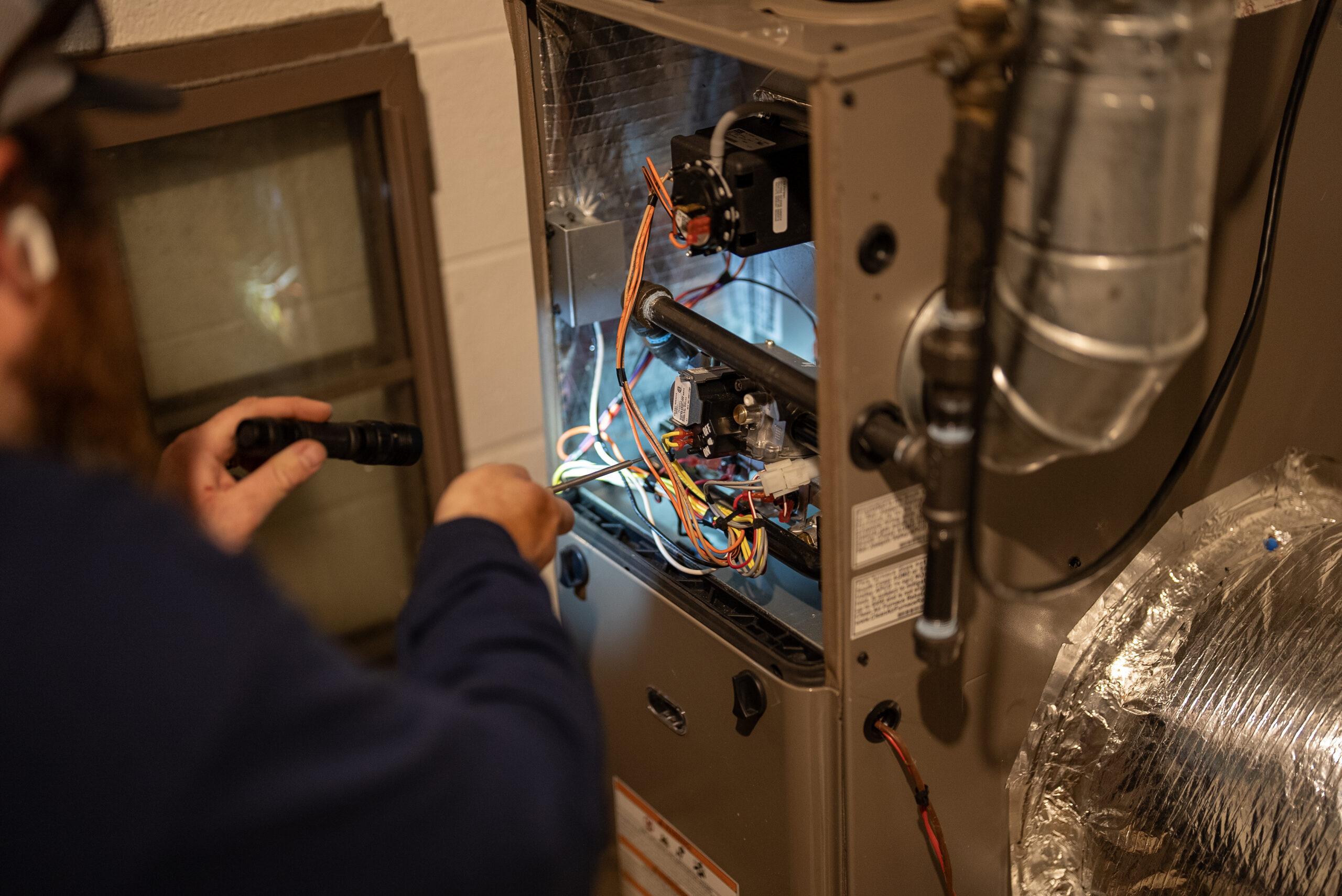 Technician working on an HVAC unit