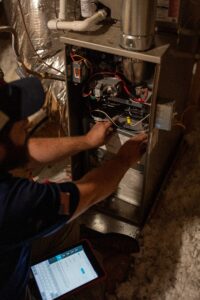 Technician working on an open heating system.