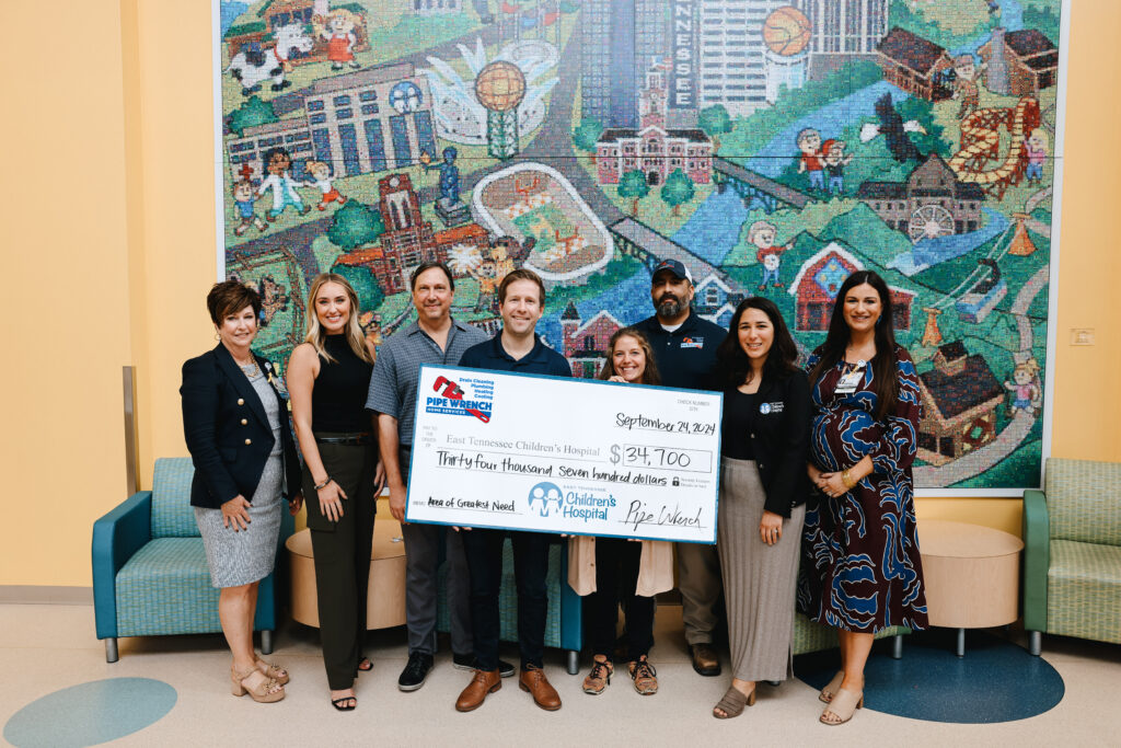Pipe Wrench Home Services presenting a check to the Each Tennessee Children's Hospital